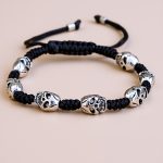 Handmade in Nepal by skilled artisans, this wrist mala features skull beads, symbolizing impermanence and fostering spiritual growth while promoting balance and protection against negative energies.