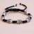 Handmade in Nepal by skilled artisans, this wrist mala features skull beads, symbolizing impermanence and fostering spiritual growth while promoting balance and protection against negative energies.
