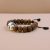 Handmade in Nepal by skilled artisans, this Antique Flat Bodhi Seed Wrist Mala embodies the essence of wisdom and enlightenment, enhancing meditation and spiritual connection.