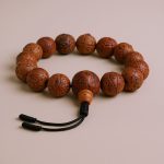 Bodhi seed wrist mala, handmade in Nepal by skilled artisans, offers spiritual grounding and clarity, fostering meditation and emotional balance as you connect with the essence of Vajrayana Buddhism.