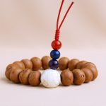 Bodhi Seed Wrist Mala, handcrafted in Nepal by skilled artisans, embodies the essence of the Buddha's teachings, supporting your meditation practice and spiritual journey with its calming energy.