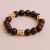 Handmade in Nepal by skilled artisans, this Bodhi wrist mala features sacred seeds and Yak bone skulls, reminding us of impermanence while supporting meditation and spiritual growth.
