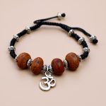 Handmade in Nepal, this wrist mala features Bodhi seeds and the sacred Hindu Om, guiding your meditation and fostering inner calm and spiritual clarity.