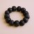 This Large Dark Antique Rudraksha Seed Wrist Mala, handmade in Nepal by skilled artisans, connects the wearer to Lord Shiva's blessings, supporting meditation and spiritual growth.