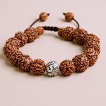 This Rudraksha Bead Wrist Mala, handmade in Nepal by skilled artisans, embodies the five aspects of Lord Shiva, serving as a potent aid for meditation and spiritual practice.