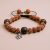 Handmade in Nepal by skilled artisans, this 5 faces Rudraksha seed wrist mala with a Hamsa charm fosters spiritual connection and protection, embodying harmony and well-being.