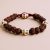 The Skull Beads Rudraksha Seed Wrist Mala, handmade in Nepal by skilled artisans, symbolizes the transient nature of life and invites the grace of Lord Shiva into daily practice.
