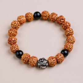 Handmade in Nepal by skilled artisans, this 5 Faces Rudraksha Seed Wrist Mala serves as a sacred tool, promoting inner peace and grounding on your spiritual journey.
