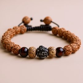 Handmade in Nepal by skilled artisans, this wrist mala of Rudraksha and lotus seed beads embodies spiritual significance, supporting meditation and mindfulness on your journey towards inner peace.