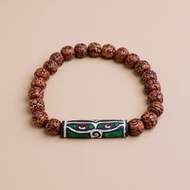 Discover the Wisdom Buddha Eyes Rudraksha Seed Wrist Mala, handmade in Nepal by skilled artisans. This sacred bracelet nurtures meditation, intuition, and inner insight for spiritual seekers.