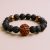 Handmade in Nepal by skilled artisans, this wrist mala features 6-faced Rudraksha beads and lava stone, symbolizing transformation and enhancing your meditation practice.