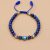 Handmade in Nepal by skilled artisans, this 6 mm Evil Eye Lapis Lazuli Wrist Mala promotes inner wisdom and harmony, serving as a protective tool against negative energies.