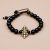 Handmade in Nepal by skilled artisans, this wrist mala combines Black Obsidian and Onyx, supporting your meditation practice and enhancing emotional balance on your spiritual journey.