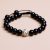 Handmade in Nepal, this Black Onyx wrist mala features carved sacred mantras, serving as a powerful companion for meditation and a source of emotional balance and inner peace.