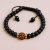 Handmade in Nepal by skilled artisans, this wrist mala combines Black Onyx and Rudraksha seeds, promoting protection, spiritual balance, and positive energy on your journey.