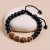 Handmade in Nepal by skilled artisans, this wrist mala features black onyx stones and Rudraksha seeds, serving as a powerful companion for meditation and spiritual growth.