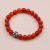 Handmade in Nepal by skilled artisans, this Carnelian Stone Wrist Mala features a carved Tibetan mantra bead, enhancing vitality and supporting your spiritual journey with each mindful moment.