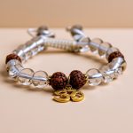 Handmade in Nepal by skilled artisans, this wrist mala features crystal stone and rudraksha seeds, fostering spiritual growth, clarity, and connection to higher consciousness during meditation.
