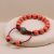 Handmade in Nepal by skilled artisans, this Inlaid Brass Powder Coral Stone Wrist Mala embodies harmony and protection, guiding your spiritual journey with each mindful practice.