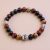 Handmade in Nepal by skilled artisans, this wrist mala features Red Picasso Jasper and sacred Tibetan mantra beads, fostering emotional balance and spiritual connection in your practice.