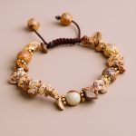 Handmade in Nepal, this wrist mala features Picture Jasper for grounding and emotional stability, adorned with White Metal Rings, symbolizing unity and protection on your spiritual journey.