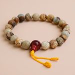 Handmade in Nepal by skilled artisans, this Jasper Stone Wrist Mala serves as a meaningful companion on your spiritual journey, fostering grounding and emotional balance.