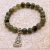 Handmade in Nepal by skilled artisans, this Labradorite Stone & Buddha Wrist Mala serves as a spiritual companion, promoting healing, protection, and the wisdom of Buddha in daily life.