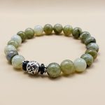 Handmade in Nepal by skilled artisans, this wrist mala features labradorite for clarity and a white metal charm symbolizing resilience, guiding your spiritual journey with mindful intention.