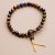 Handmade in Nepal by skilled artisans, this Lapis Lazuli Tiger Eye Stone Wrist Mala supports meditation and emotional balance, fostering courage, wisdom, and spiritual awareness on your journey.