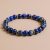 Handmade in Nepal by skilled artisans, this Lapis Lazuli Wrist Mala with white metal rings supports spiritual practice, fostering intuition, wisdom, and emotional balance on your journey toward enlightenment.