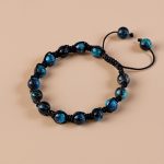 Light Blue Tiger Eye Stone Hand-Knotted Wrist Mala, handmade in Nepal by skilled artisans, symbolizes life's journey, fostering emotional balance and clarity for your meditation practice.