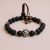 Handmade in Nepal by skilled artisans, this wrist mala features Lava Stone for grounding and Hematite for clarity, embodying strength and courage for your spiritual journey.