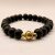 Handmade in Nepal by skilled artisans, this Matte Onyx wrist mala features a White Metal Flower, symbolizing purity and mindfulness, supporting your spiritual journey with grounding and clarity.