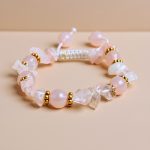 The Rose Quartz Stone Wrist Mala, handmade in Nepal by skilled artisans, promotes love and emotional healing, enhancing meditation and spiritual practice through its calming energies.