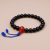 Shining Blue Sun Stone Wrist Mala, handmade in Nepal by skilled artisans, embodies the sun's energy, enhancing vitality and emotional balance during meditation and spiritual practice.