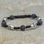 Handmade in Nepal by skilled artisans, this wrist mala combines skull beads and carnelian stones, symbolizing impermanence and emotional balance for meditation and reflection.