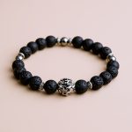 Handcrafted in Nepal, this Tibetan Mantra Lava Stone Wrist Mala connects you to the earth, supporting emotional stability and self-awareness during meditation and daily life.