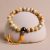 The Yellow Tiger Eye Stone Wrist Mala, handmade in Nepal by skilled artisans, supports your spiritual journey with its protective and clarifying energies, fostering courage and intuition in daily practice.