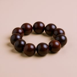 Embrace the sacred with this 15 mm Red Sandalwood Wrist Mala, handmade in Nepal by skilled artisans. It purifies energy and supports spiritual growth, enhancing your meditation practice.