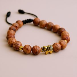 The Bayong Wood Wrist Mala with Elephant Beads, handmade in Nepal by skilled artisans, embodies the wisdom of elephants, reminding us of patience and perseverance on our spiritual journey.