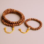 Handmade in Nepal by skilled artisans, this Brown Sandalwood Japa Mala aids meditation, dispelling negativity and fostering a deep connection to the present moment through its calming energy.