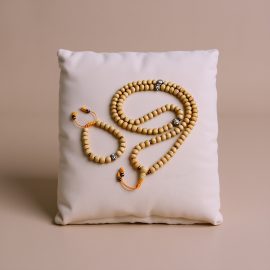 Handmade in Nepal by skilled artisans, this Raw Sandal Wood Japa Mala and Wrist Mala set enhances meditation with its fragrant beads, supporting spiritual growth and protection on your journey.