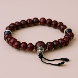 Handmade in Nepal by skilled artisans, this Rosewood Wrist Mala with Yak Bone Beads nurtures serenity and supports spiritual growth, reminding us of life's impermanence and deeper insights.