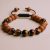 Handmade in Nepal by skilled artisans, this Sandalwood & Tiger Eye Stone Wrist Mala supports mindfulness and meditation, guiding the wearer towards clarity and inner peace.