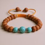 This handmade Sandalwood Wrist Mala from Nepal, adorned with turquoise, supports meditation and self-expression, inviting tranquility and clarity into your spiritual practice.