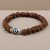 Handmade in Nepal by skilled artisans, this Amulating Dzi and Rudraksha Seed Wrist Mala fosters spiritual growth and protection, harmonizing energies for a deeper journey along your path.