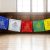 These handmade Tibetan prayer flags from Nepal feature revered deities, promoting peace and compassion, enhancing your meditation space, and supporting your spiritual journey with authentic symbolism.