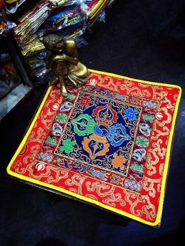 This handmade Tibetan altar cloth, crafted in Nepal, features a sacred dorje and lotus design, symbolizing enlightenment and spiritual strength, enriching your meditation space with tranquility.