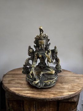 Handmade in Nepal by skilled artisans, this Green Tara statue embodies compassion and protection, serving as a spiritual guide on your journey toward overcoming obstacles.