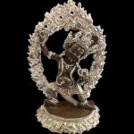 This handmade copper statue of Vajrapani Chana Dorje, crafted in Nepal, symbolizes strength and protection on the journey to enlightenment. A testament to traditional artisanship.